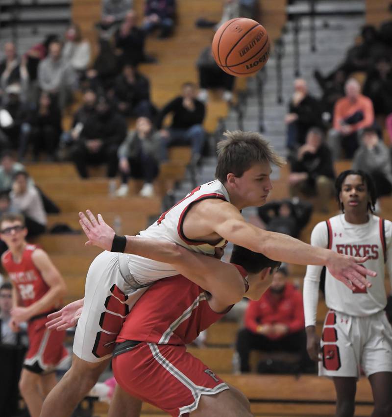 Yorkville’s Taelor Clements falls on Palatine’s Connor May in a quarterfinal game of the Jack Tosh Classic at York High School in Elmhurst on Thursday, Dec. 28, 2023.