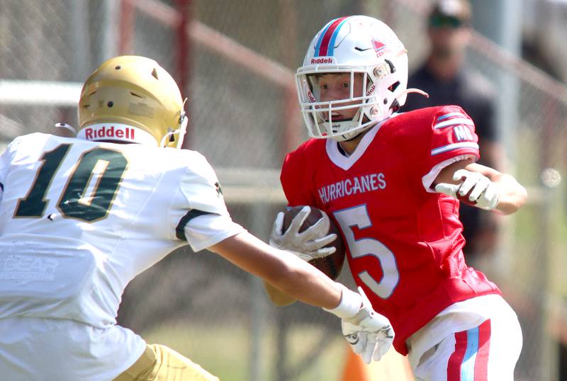 Marian Central’s Michael Schmid runs the ball against Bishop McNamara in varsity football action on Saturday, Sept. 14, 2024, at George Harding Field on the campus of Marian Central High School in Woodstock.