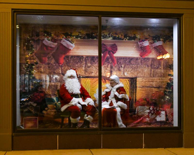 Santa Claus and Mrs. Claus are ready to greet community members during the Sycamore Chamber of Commerce's annual Moonlight Magic event held in downtown Sycamore on Friday, Nov. 17, 2023.