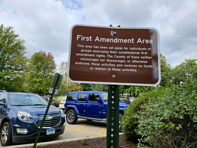 Kane County officials created a special area for people to stand if they are passing out literature to those going in and out of the Government Center. The Kane County GOP Chairman Andro Lerario protested it as a violation of their rights.