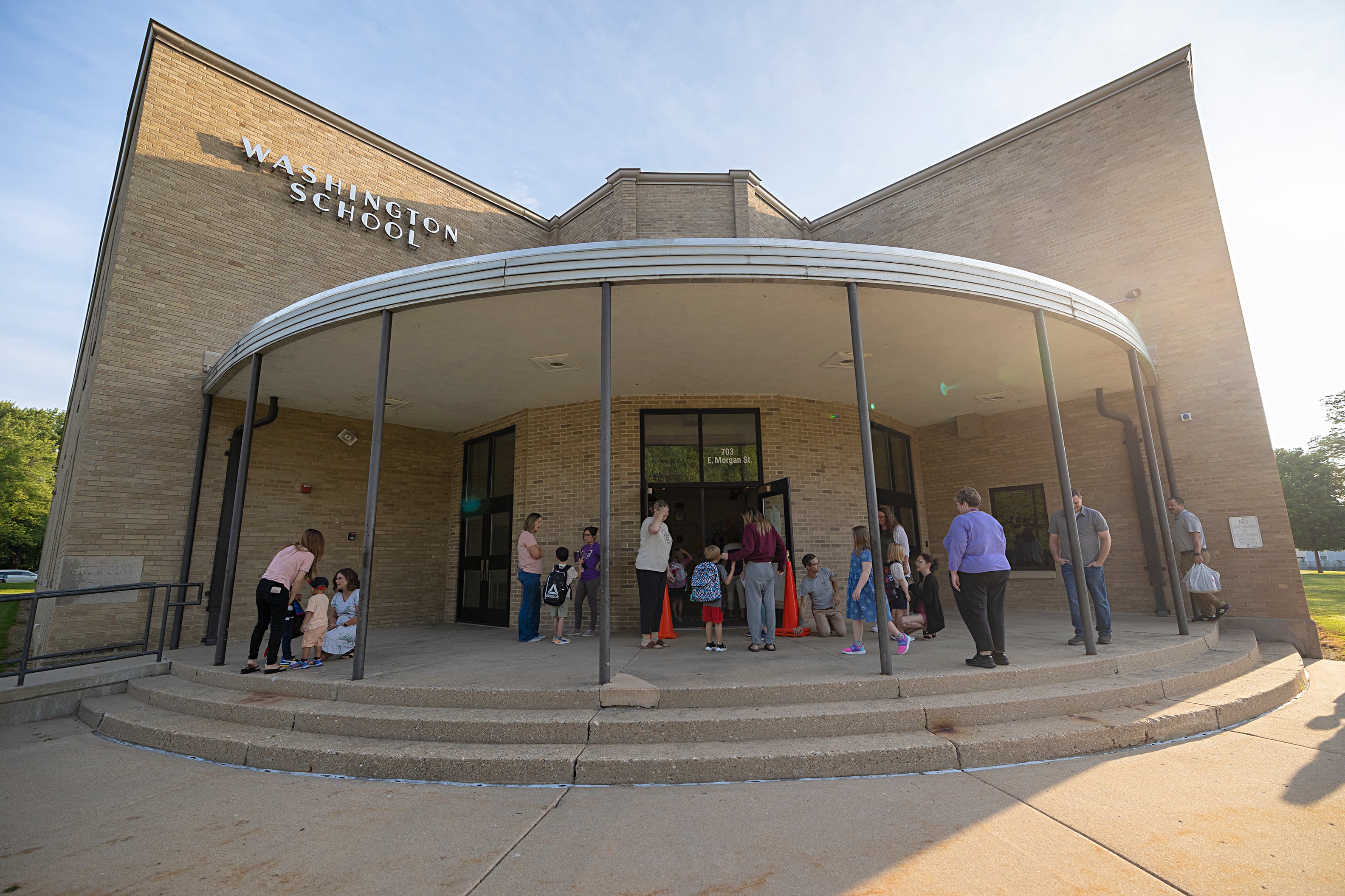 Kids and parents gather outside of Washington School in Dixon Wednesday, Aug. 14, 2024 for the first day of school.