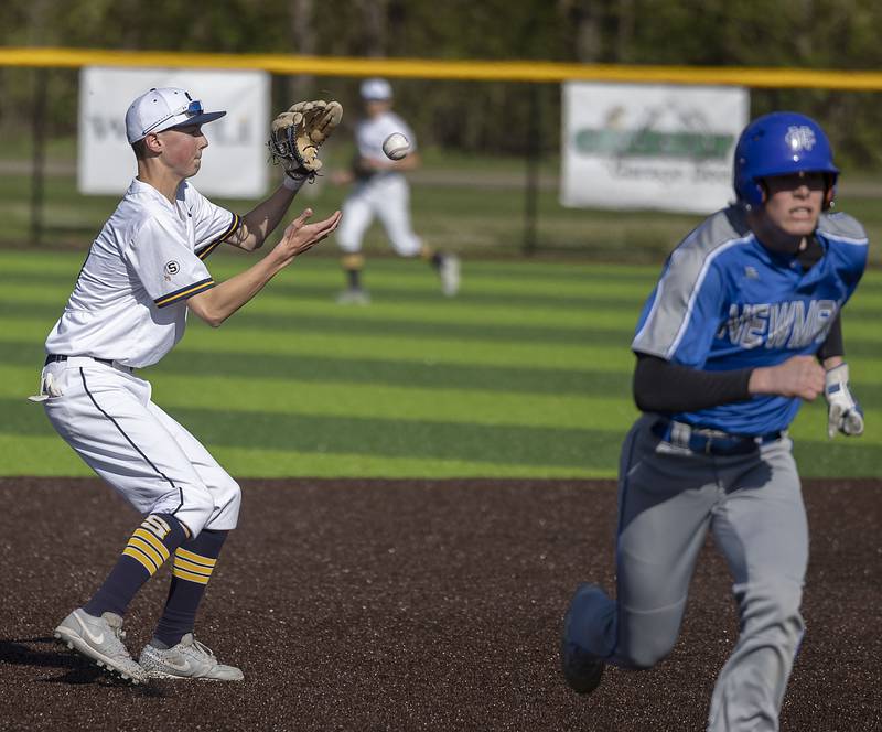 Sterling’s Bryce Hartman plays a ball at shortstop against Newman Wednesday, May 3, 2023.