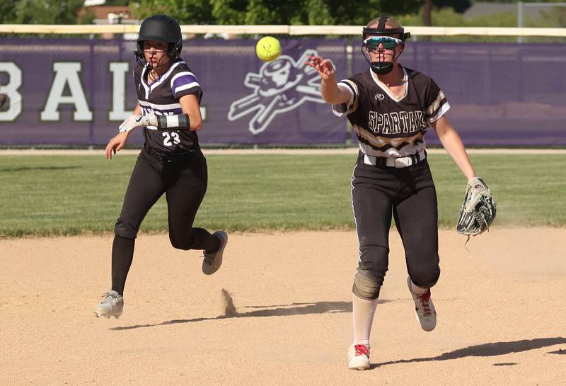 Sycamore's Keera Trautvetter flips the ball to third to force out Dixon’s Kennedy Haenitsch during their Class 3A regional championship game Thursday, May 23, 2024, at Rochelle High School.