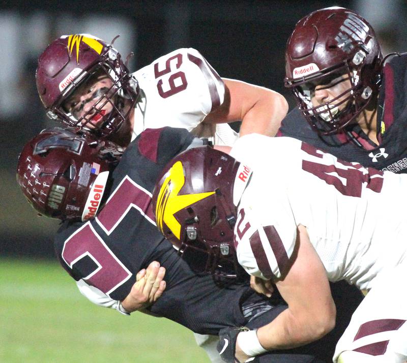 Richmond Burton’s Trevor Szumanski tackles Marengo’s Connor Sacco  in varsity football at Rod Poppe Field on the campus of Marengo High School in Marengo on Friday, Oct. 18, 2024.