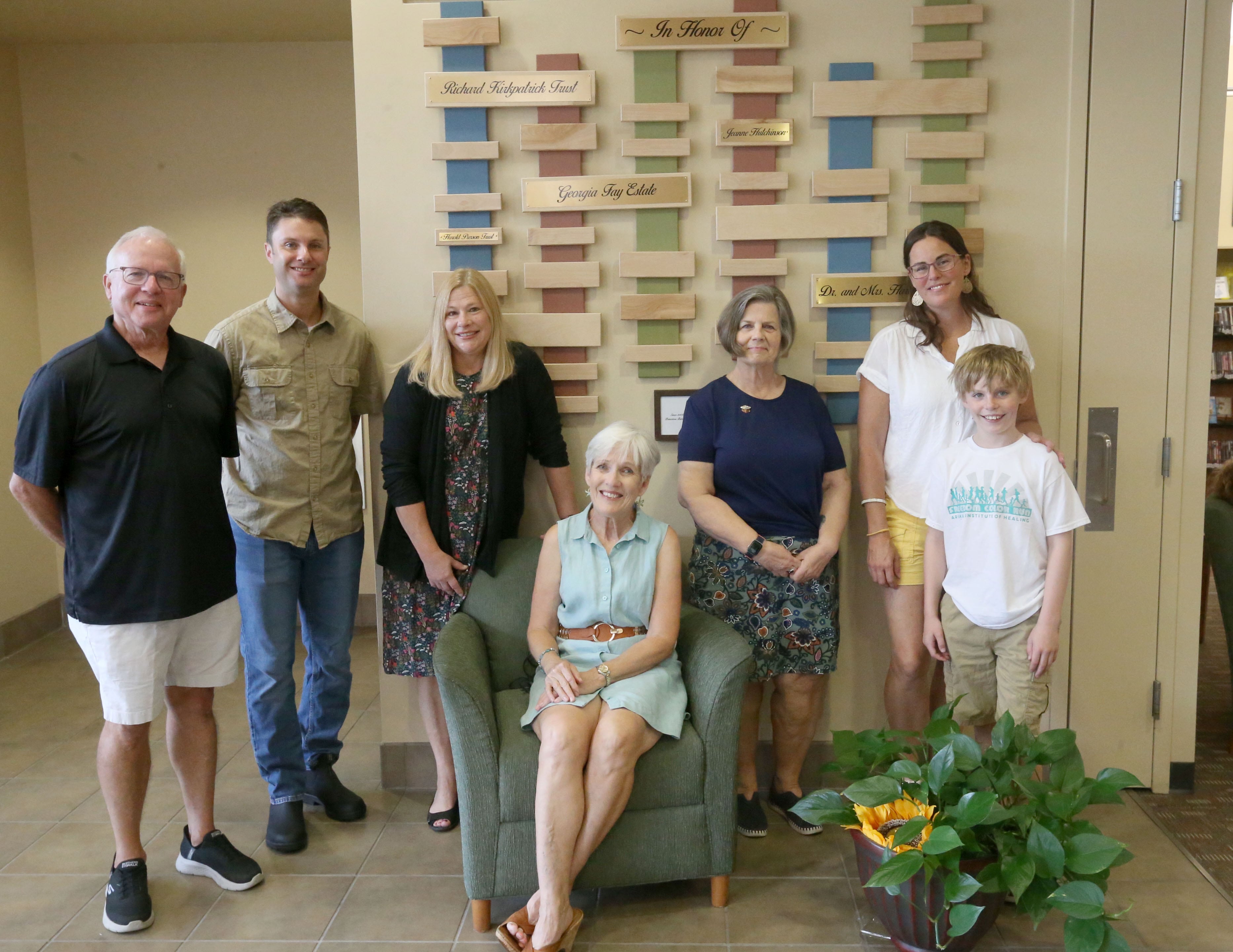 Princeton Public Library board members (from left) Jerry Thompson, Tony Bonucci president, Julie Wayland director, Jan English board member, Lani Swinford secretary, Lauren Smith boart member and son Eli pose next to the new donor recognition wall at the Princeton Public Library on Thursday, Aug. 1, 2024. The Princeton Public Library Board of Trustees and staff are celebrating 17 years at the Peru Street location. The occasion provides the perfect opportunity for the library to publicly announce the installation of a new donor recognition wall. The new structure highlights the most generous, one-time donations the library has received since the opening. Initially, the library opened the Americans with Disabilities Act compliant facility on Aug. 1, 2017. The upgrade was primarily funded through the generosity of the community. These donors are prominently displayed throughout the building.