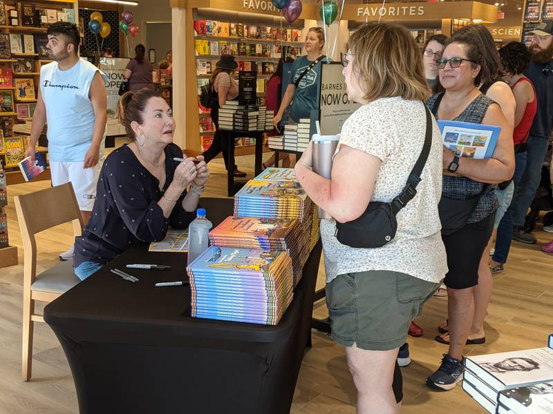 During the June 12 grand opening of the new Barnes & Noble store in Oswego, children’s author Sherri Duskey Rinker was at the store signing copies of her books.