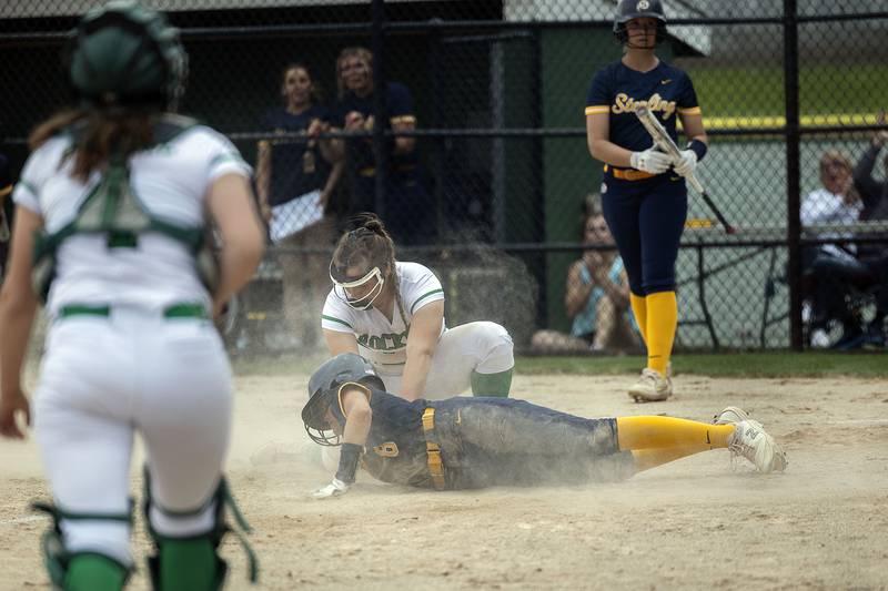 Sterling’s Marley Sechrest is tagged out at home by Rock Falls’ Katie Thatcher trying to score on an error against Rock Falls Friday, May 5, 2023.