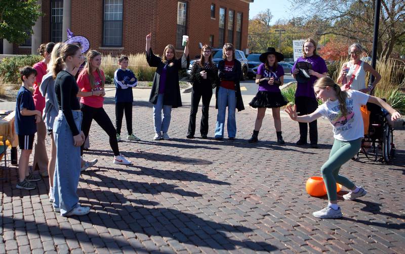 Attendees play charades at the Witches and Wizards of Woodstock on Sunday, Oct. 20,2024 in Woodstock.