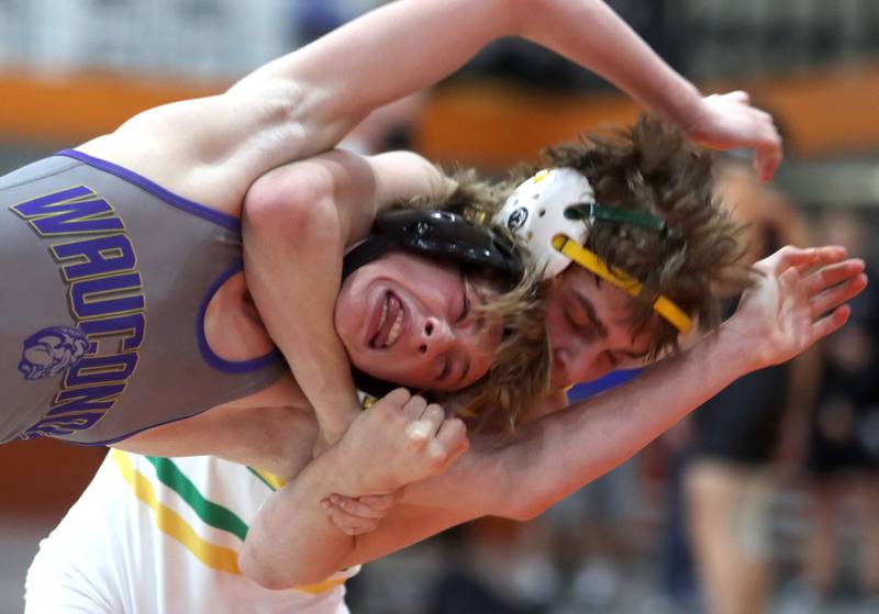 Crystal Lake South’s Josh Glover, right, won the title bout at 113 pounds over Wauconda’s Gavin Rockey during IHSA Class 2A regional wrestling at Crystal Lake Central Saturday.