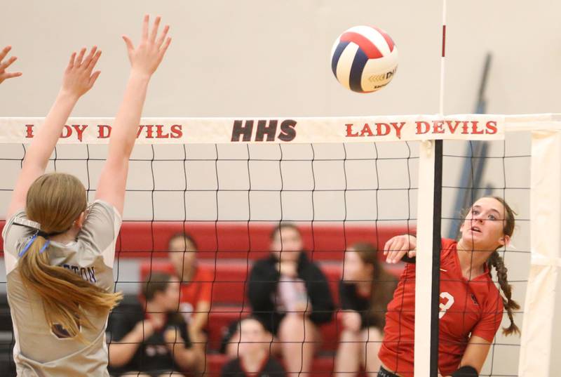 Hall's Kannedy Wozniak spikes the ball past Princeton's Danika Burden on Tuesday, Sept. 17, 2024 at Hall High School.