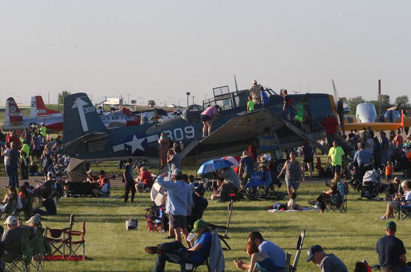 People tour a TBM Avenger aircraft during the annual TBM Avenger Reunion and Air Show on Friday, May 17, 2024 at the Illinois Valley Regional Airport in Peru.