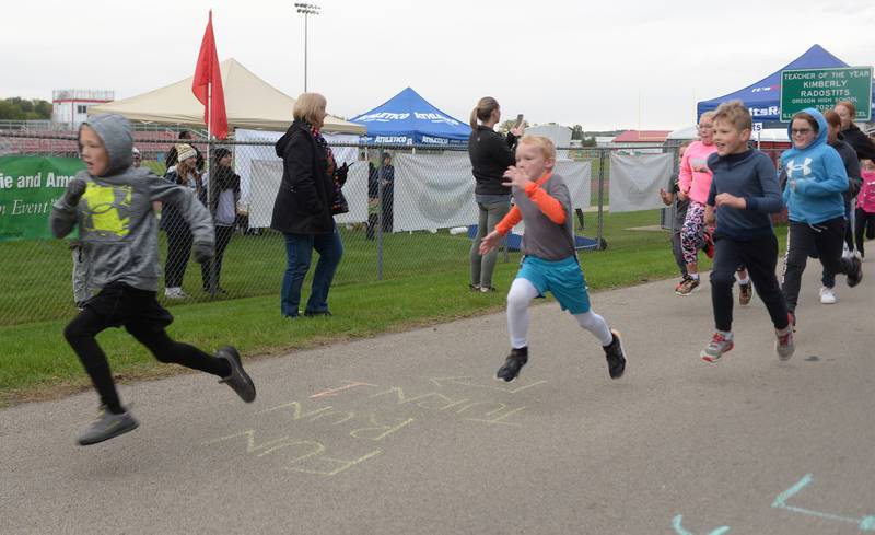 :Lane Groenhagen of Oregon and Levi Thibodeau of German Valley start the 1-Mile Fun Run during Autumn on Parade on Sunday, Oct. 8 at Oregon Park West.