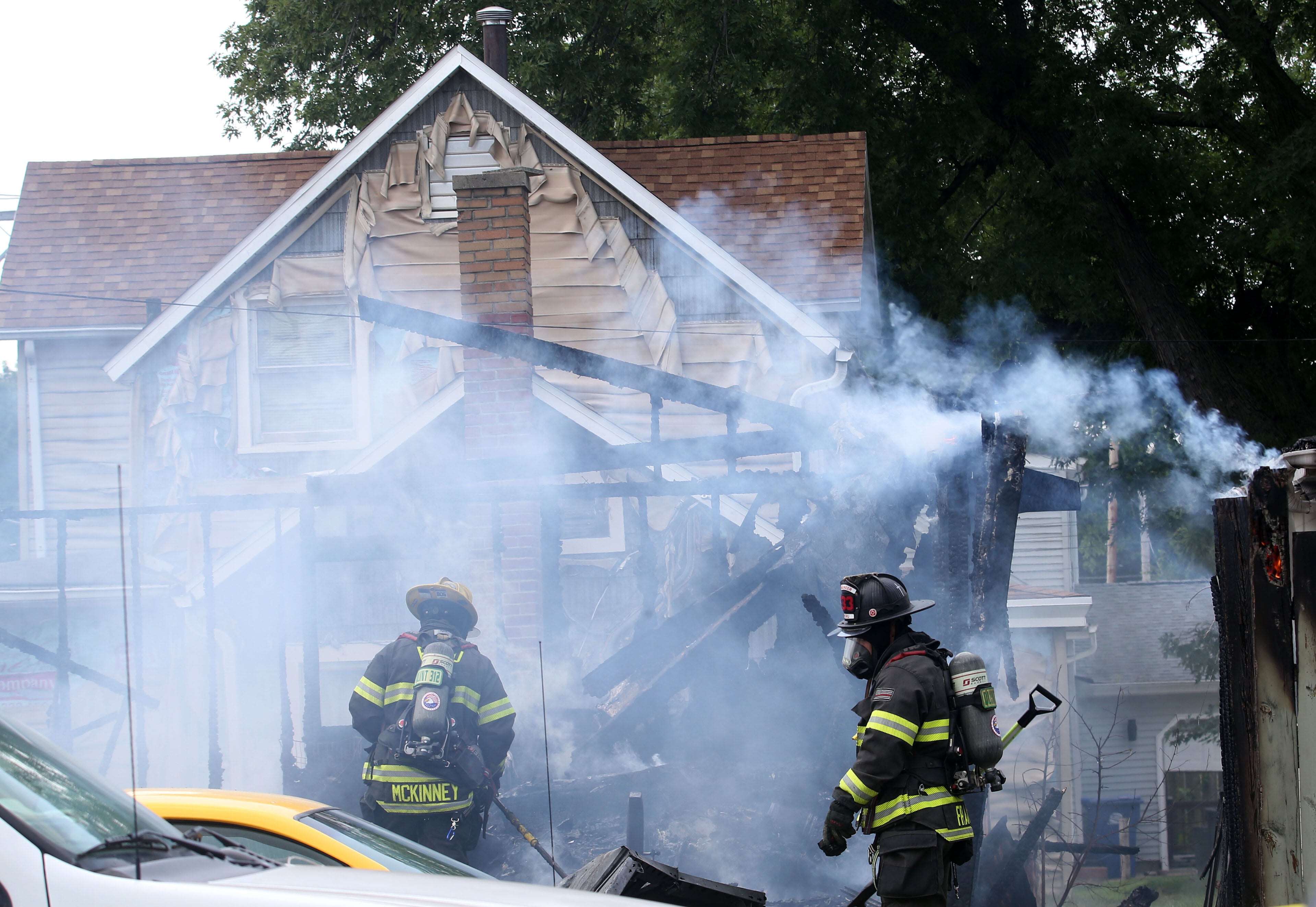 Peru firefighters Jake McKinney and Ryan Frank extinguish flames from a garage fire in the 800 block of Lafayette Street on Monday, July 22, 2024. The fire began just before 1p.m. La Salle Fire and EMS along with Peru Fire department responded to the call while La Salle Police directed traffic.