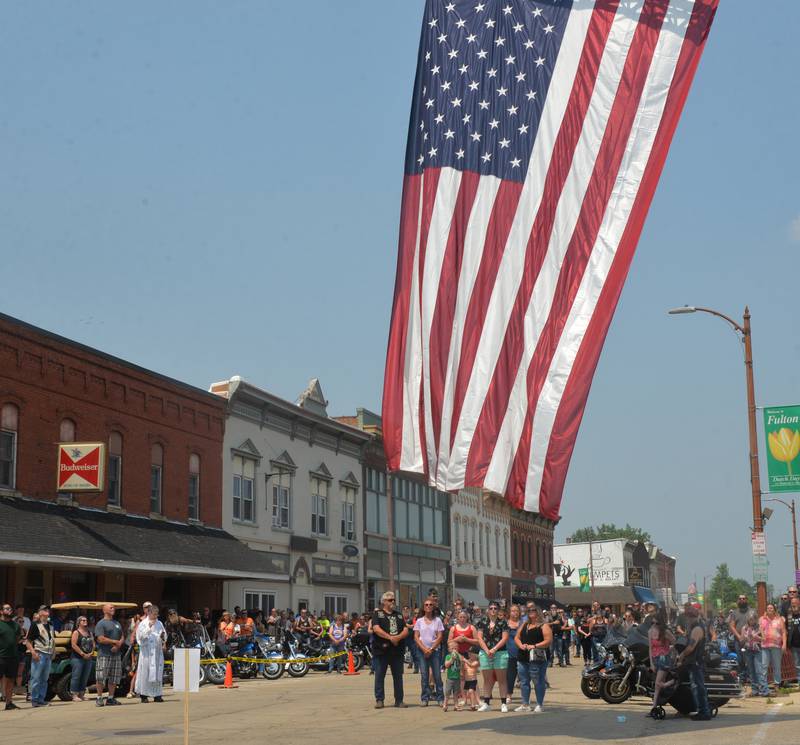 More than 200 motorcycles and their riders showed up in Fulton on Sunday, June 4 for the"Blessing of the Bikes", an event started Jules Meiners of Fulton in her driveway several years ago. "It got so big we moved it to the main drag," she said. Clergymen blessed the bikes asking for a safe riding season. Here, bikers listen to the National Anthem before the blessings began.