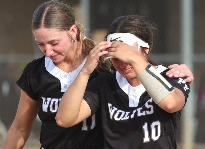 Prairie Ridge's Kendra Carroll (left) consoles teammate Emily Harlow after their Class 3A sectional final loss to Sycamore Friday, May 31, 2024, at Sycamore High School.