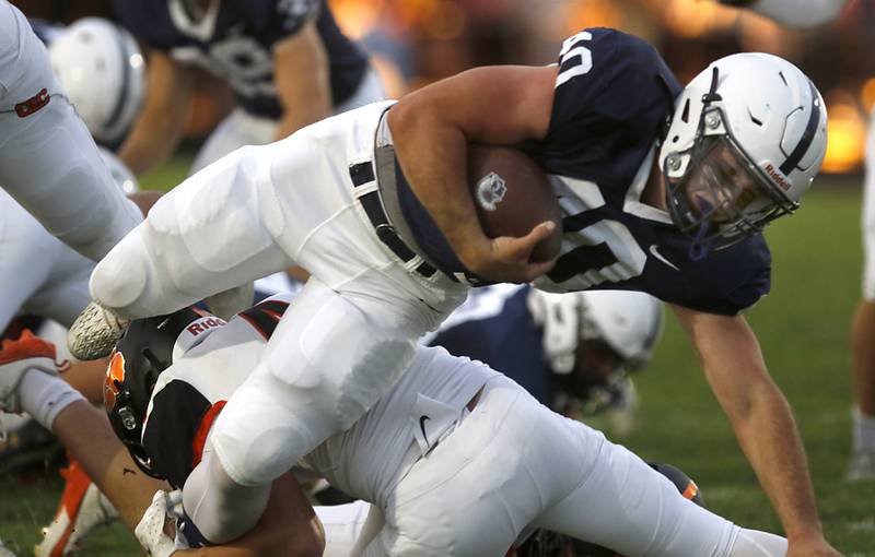 Cary-Grove's Logan Abrams fights for extra yards during a Fox Valley Conference football game against Crystal Lake Central on Friday, Sept. 6, 2024, at Cary-Grove High School in Cary.