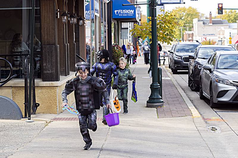 Costumed characters run rampant through the streets of Dixon Saturday, Oct. 28, 2023.