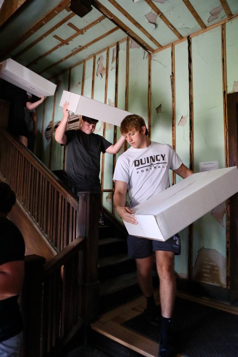 PHS senior Arthur Burden helped move boxes from the third floor of the Sash Stalter Matson Building to the basement in a matter of 15 minutes for the Bureau County Historical Society.