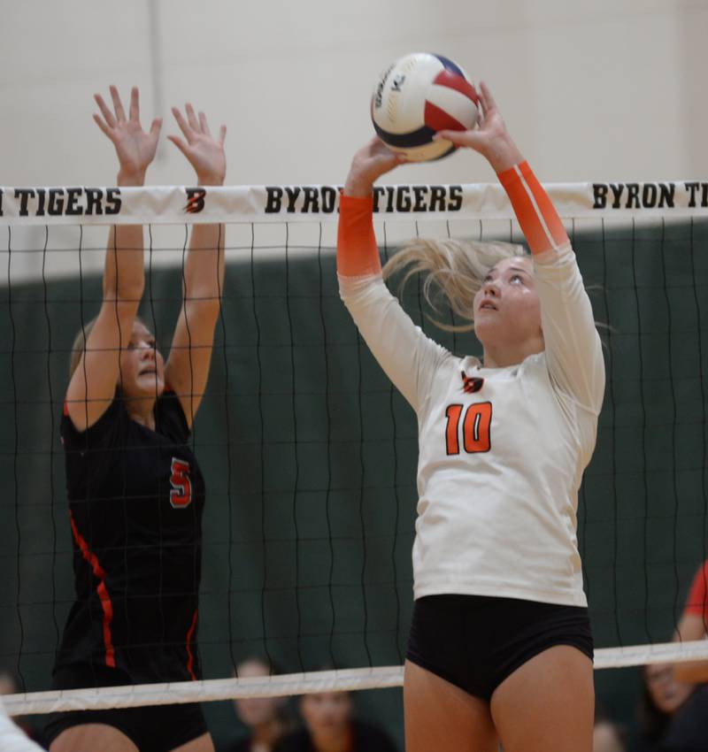 Byron's Delaney Henert (10) sets the volleyball during Saturday, Sept. 14, 2024 action at the Varsity Power Classic Tournament at Byron High School.