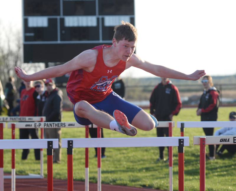 Morrison's Josh McDearmon clears a hurdle as she heads to the finish line in the 100 hurdles at the Ed Schmidt Invitational Track Meet at Erie High School on Friday, April 19, 2024.