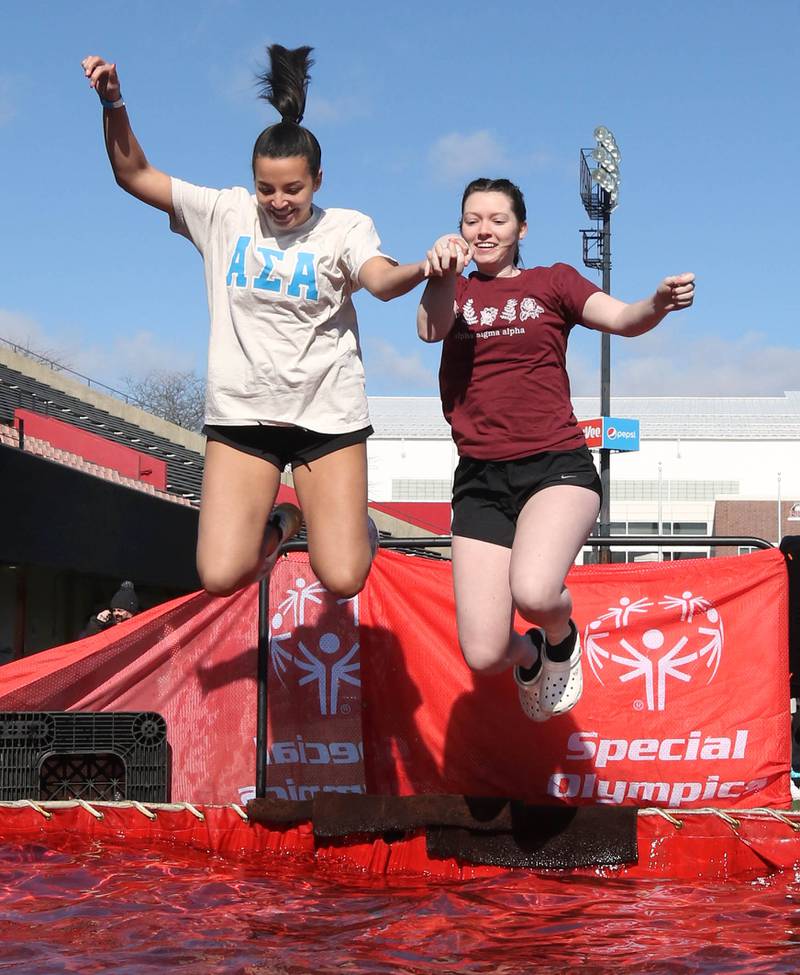 Members of the Alpha Sigma Alpha sorority jump into the water on a cold and windy Saturday, Feb 17, 2024, during the Huskie Stadium Polar Plunge at Northern Illinois University in DeKalb. The Polar Plunge is the signature fundraiser for Special Olympics Illinois.