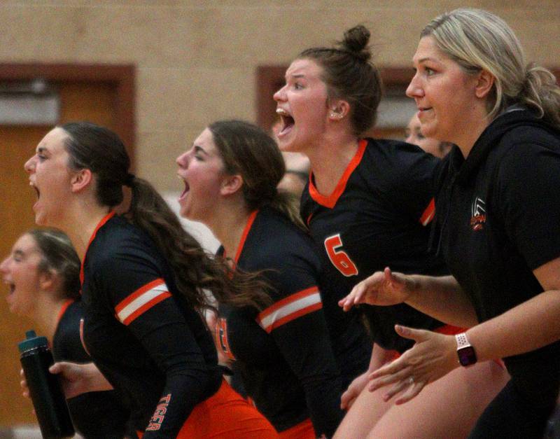 Crystal Lake Central’s Tigers celebrate during their win in a Fox Valley Conference volleyball match on Tuesday, Aug. 27, 2024, at Huntley High School.