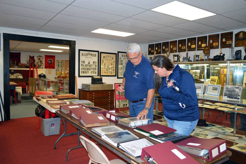 Mt. Morris Village President Phil Labash and Clerk Brooke Duffy look at some old newspaper clippings stored at the village museum on Oct. 24, 2023. The museum currently is on the lower floor of Mt. Morris Village Hall.