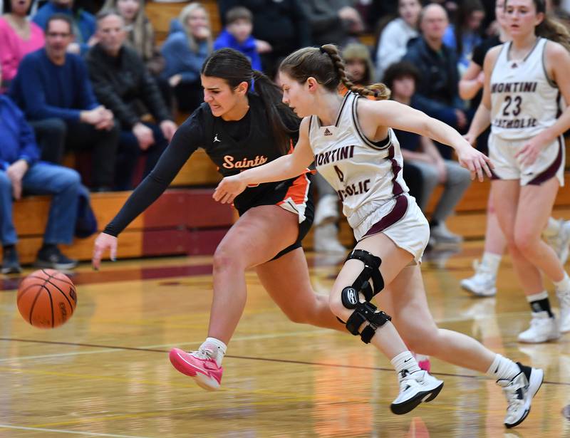 St. Charles East's Lexi DiOrio (left) and Montini's Riley White go after a loose ball during the Montini Christmas Tournament championship game on Dec. 29, 2023 at Montini Catholic High School in Lombard.