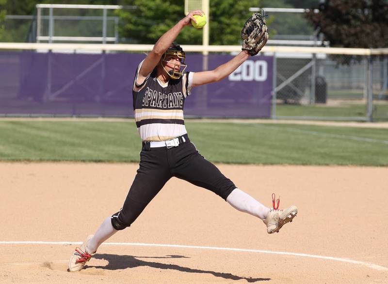 Sycamore's Bella Jacobs delivers a pitch during their Class 3A regional final against Dixon Thursday, May 23, 2024, at Rochelle High School.