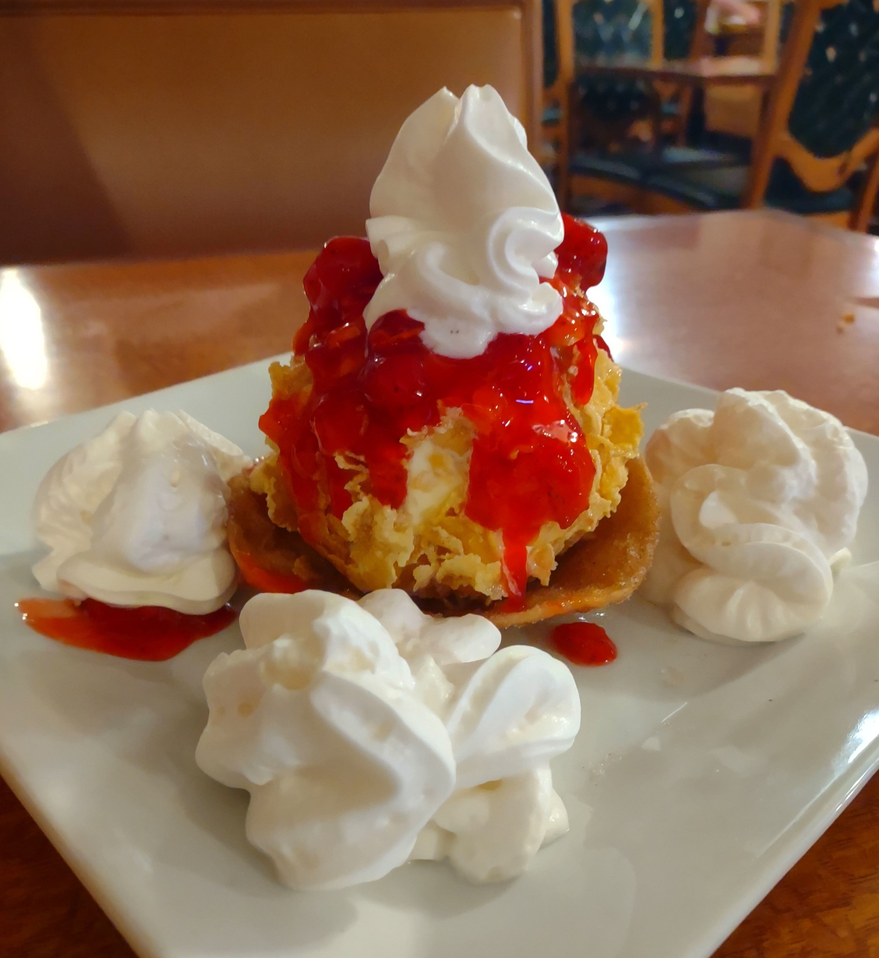 With dollops of whipped cream, the fried ice cream at Mr. Salsa's arrived topped with our choice of strawberry sauce.