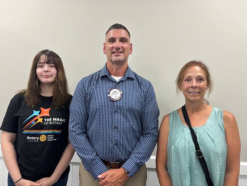 President of Rock Falls Rotary Shane Brown (center) welcomed a former exchange student sent out by Rock Falls Rotary in 1986-1987 Amy (Harms) McFarland (right). McFarkland went  to Denmark after her graduation from Rock Falls High School and then on to Scotland as an Ambassadorial Scholar where she met her husband and now lives.  On the left is Rock Falls Rotary 2024-2025 outbound Exchange student Kennedi Woodyatt who will be spending the next year in France. Youth exchange is a Rotary program to unite the world globally at the person to person level. Students who have been Rotary Exchange students have family on both sides of the Atlantic Ocean.