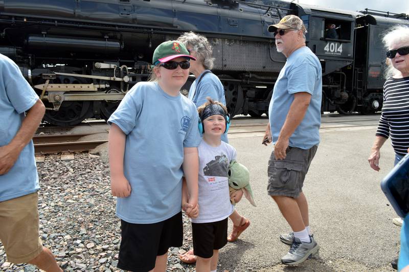 Walker Barnhart, 10 (left), and Cordell Barnhart, 5, both of Fulton, pose for a photo in front of the Union Pacific Big Boy Steam Engine No. 4014 during its whistle stop on Friday, Sept. 6, 2024, at the Sterling Marketplace.