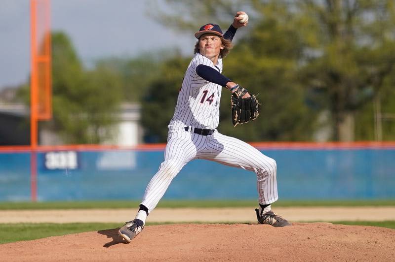 Oswego’s Noah Mottet (14) delivers a pitch against Yorkville during a baseball game at Oswego High School on Monday, April 29, 2024.