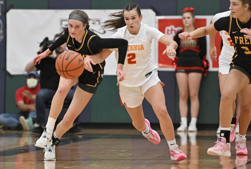 Fremd’s Ella Todd and Batavia’s Brooke Carlson chase the ball after Carlson knocked it from Todd’s grasp in the Bartlett supersectional game on Monday, Feb. 26, 2024.