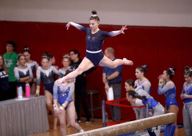 St. Charles co-op’s Emily Johnson competes on the balance beam during the IHSA Girls State Gymnastics Meet at Palatine High School on Friday, Feb. 16, 2024.
