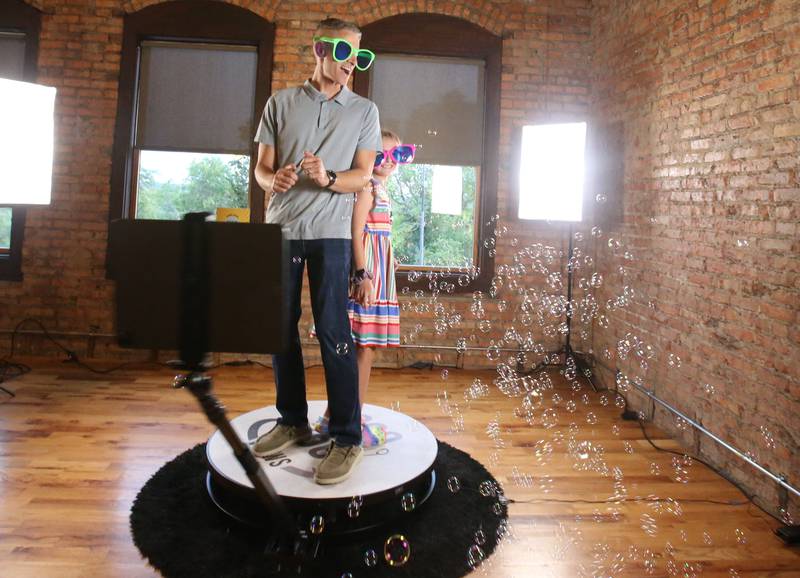 Andy Arnold and his daughter Avalean of Peru, have their photo taken on a 360 degree camera during the Best of the Illinois Valley event on Thursday, Sept. 12, 2024 at the Auditorium Ballroom in La Salle.