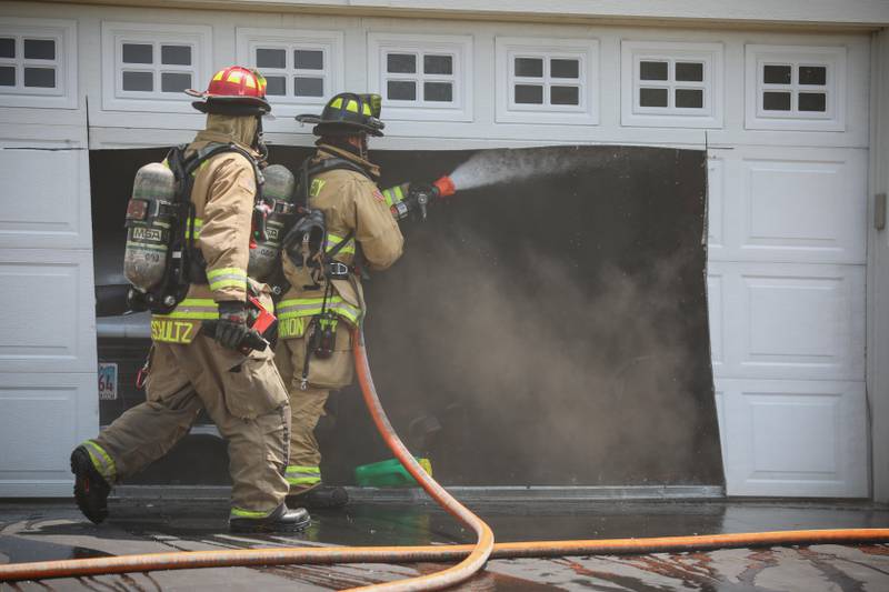 Firefighters extinguished a fire inside a garage attached to a home in Huntley within 10 minutes Thursday afternoon, according to the Huntley Fire Protection District.