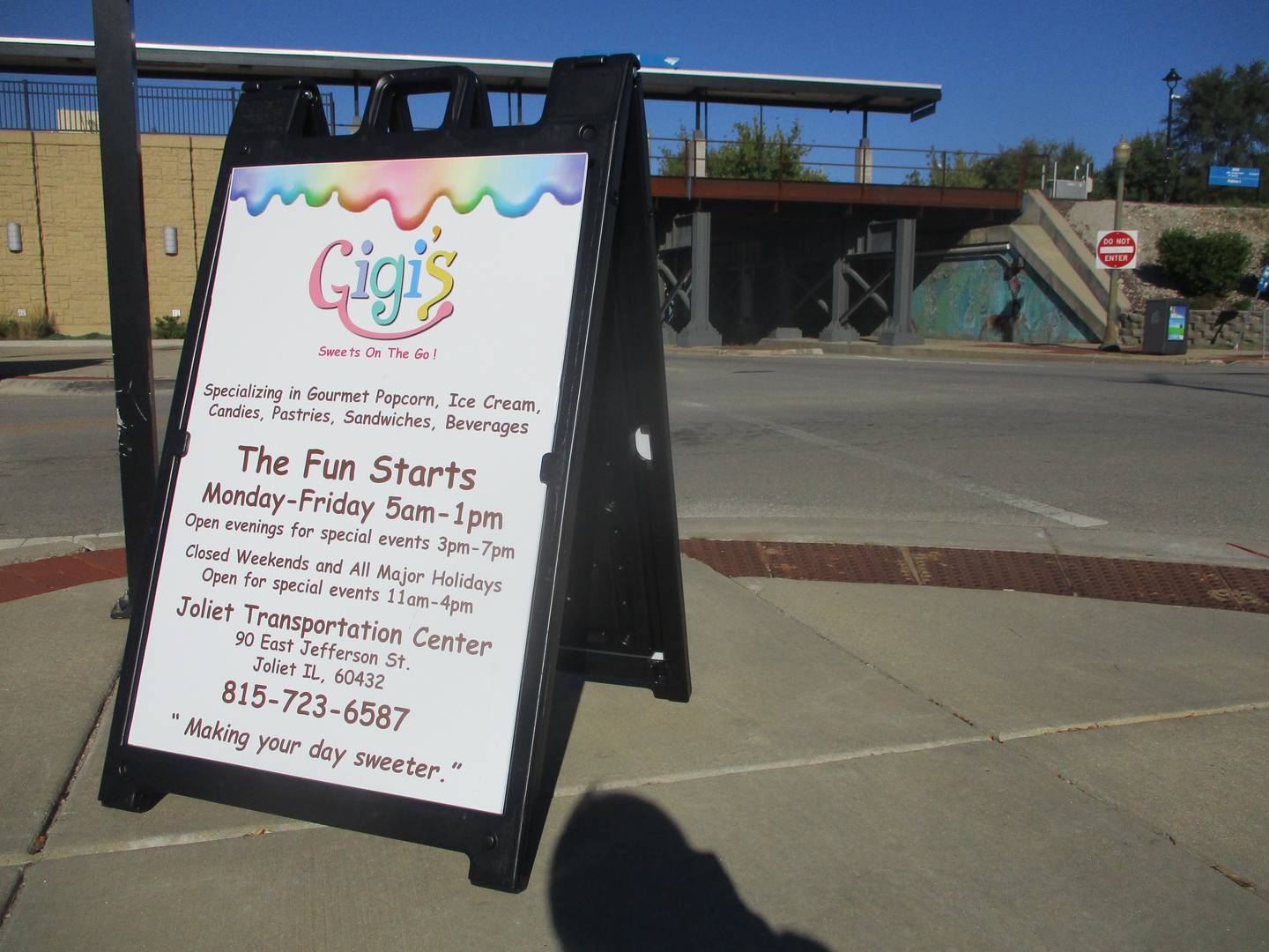 A sign board outside the Gateway Center train station at 90 E. Jefferson St. in Joliet advertises the new Gigi's Sweets on the Go.