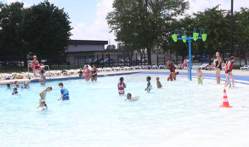 Children cool off in the splash area on Monday, June 17, 2024 at the Riordan Pool in Ottawa.