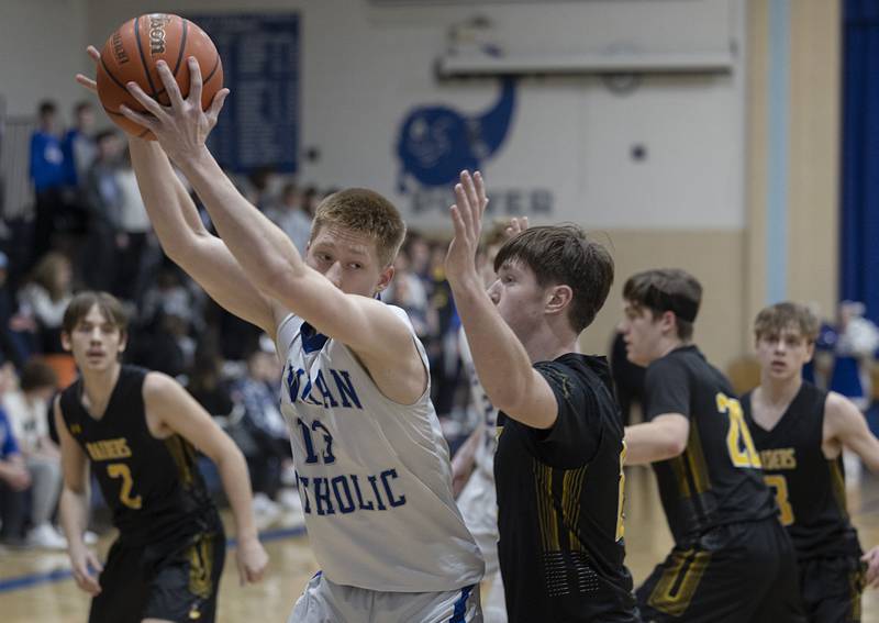 Newman’s George Jungerman works below the basket against AFC Monday, Feb. 19, 2024 in a regional quarterfinal game at Newman High School.