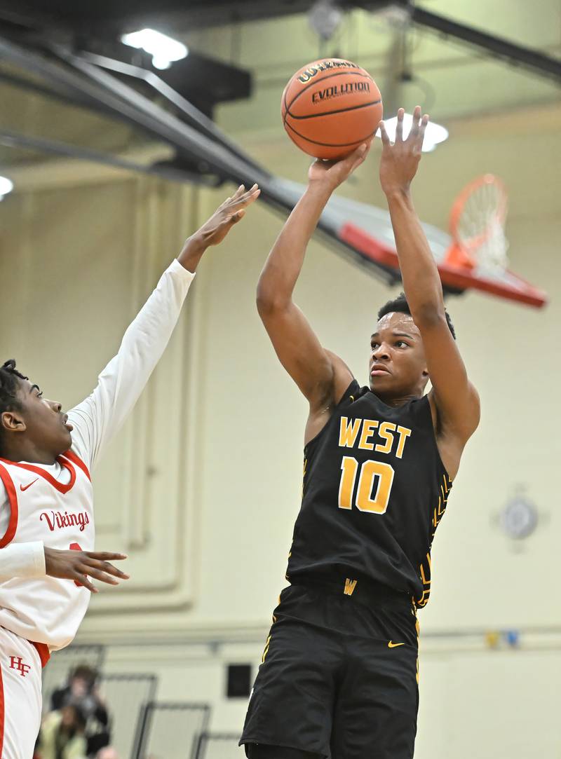 Joliet West's Zion Gross shoots a 3-point shot  during the Class 4A sectional semifinal against Homewood Flossmoor at Rich Township on Tuesday, Feb. 27, 2024, at Richton Park. (Dean Reid for Shaw Local News Network)