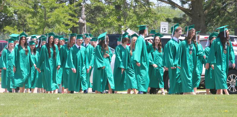 Graduates walk in procession to the Abbey Church for the commencement ceremony on Sunday, May 19, 2024 at St. Bede Academy.