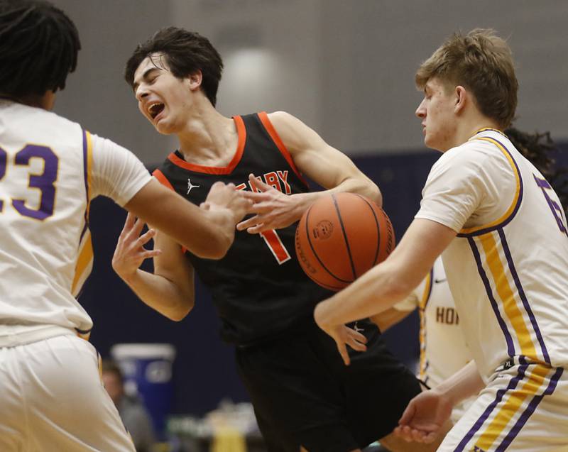 McHenry's Marko Visnjevac looses the ball after it was stripped by Hononegah's Cole Schmall during the IHSA Class 4A Guilford Boys Basketball Sectional semifinal game on Wednesday, Feb. 28, 2024, at Rock Valley College in Rockford.