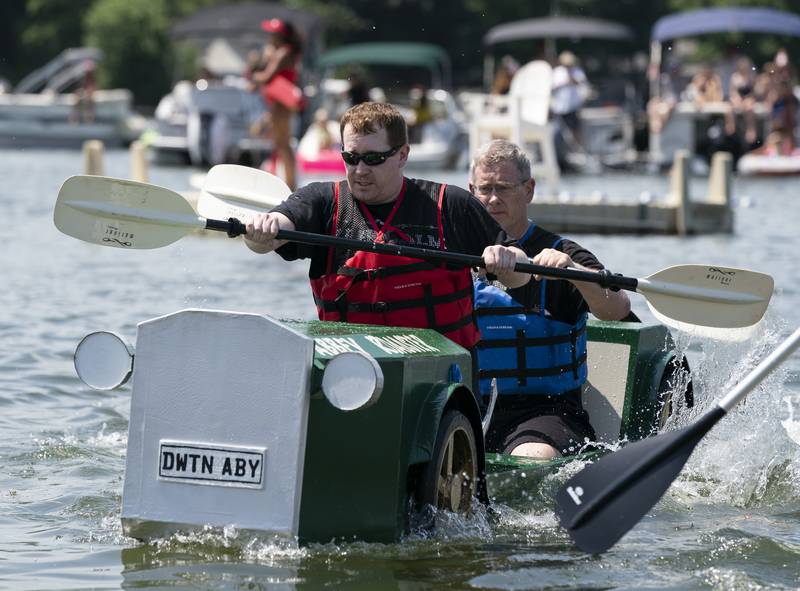 Robert Brazas (front), of Elgin, and Chris Brazas, of Hampshire, participate with their boat Abbey Roadster, during the Crystal Lake Cardboard Regatta on Saturday, July 23, 2022 at Main Beach in Crystal Lake. Cardboard took to the lake as a fundraiser for the Crystal Lake Parks Initiative Foundation. Ryan Rayburn for Shaw Local