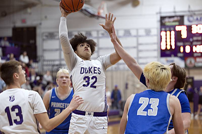 Dixon’s Darius Harrington puts up a shot against Princeton Thursday, Dec. 21, 2023 at Dixon High School.