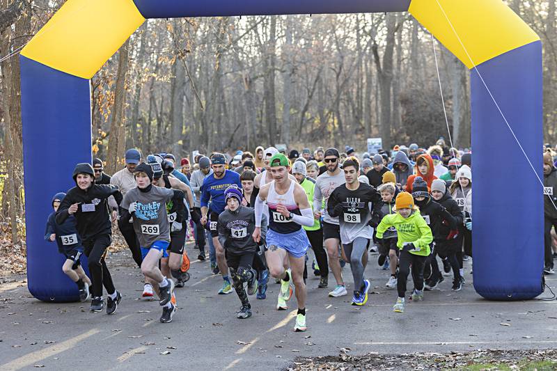 A total of 312 participants take off from the starting line Thursday, Nov. 23, 2023 at the start of the 12th annual St. Anne’s Turkey Trot at Dixon’s Lowell Park.