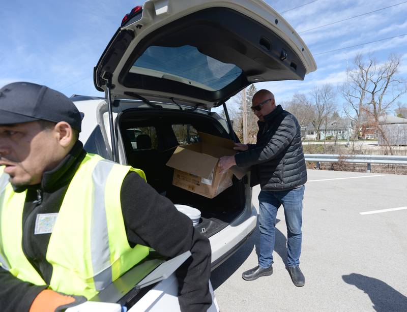 Paul Spotts of Westmont gets assistance with some of his electronic equipment from eWorks material handler Filipe Saltu during the Electronics and More Recycling event held in Westmont Saturday, April 6, 2024.