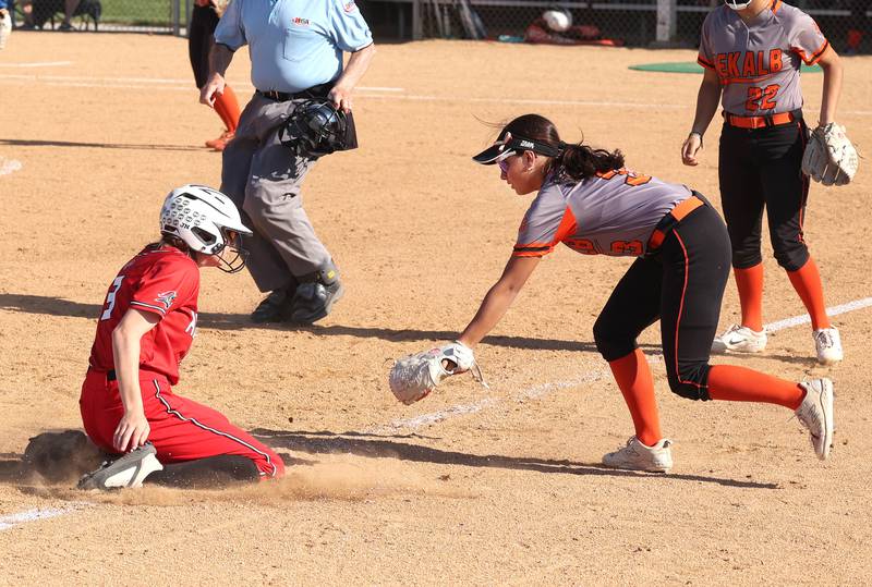 DeKalb's Emma Hart tries to make the tag after Rockford Auburn's Jayden Moss slides safely into third during their Class 4A regional semifinal game Wednesday, May 22, 2024, at Hampshire High School.