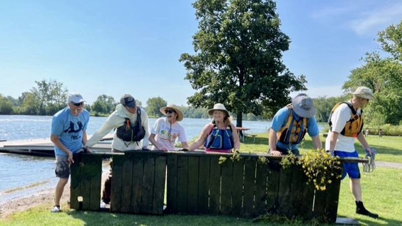 Volunteers haul waste out of the Fox River during last year's Fox River Cleanup event.