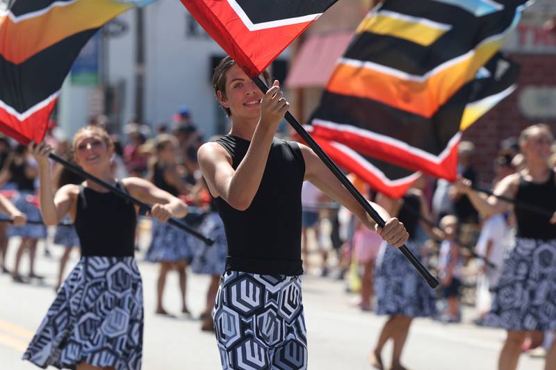 Flag bearers lead the Lincoln-Way Marching Band in the Manhattan Labor Day Parade on Monday, Sept. 4, 2023 in Manhattan.